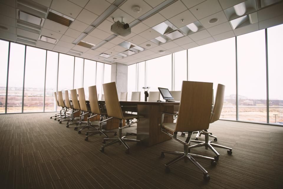 Conference room with long table and leather chairs